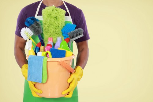 Cleaner preparing carpet cleaning equipment with safety focus